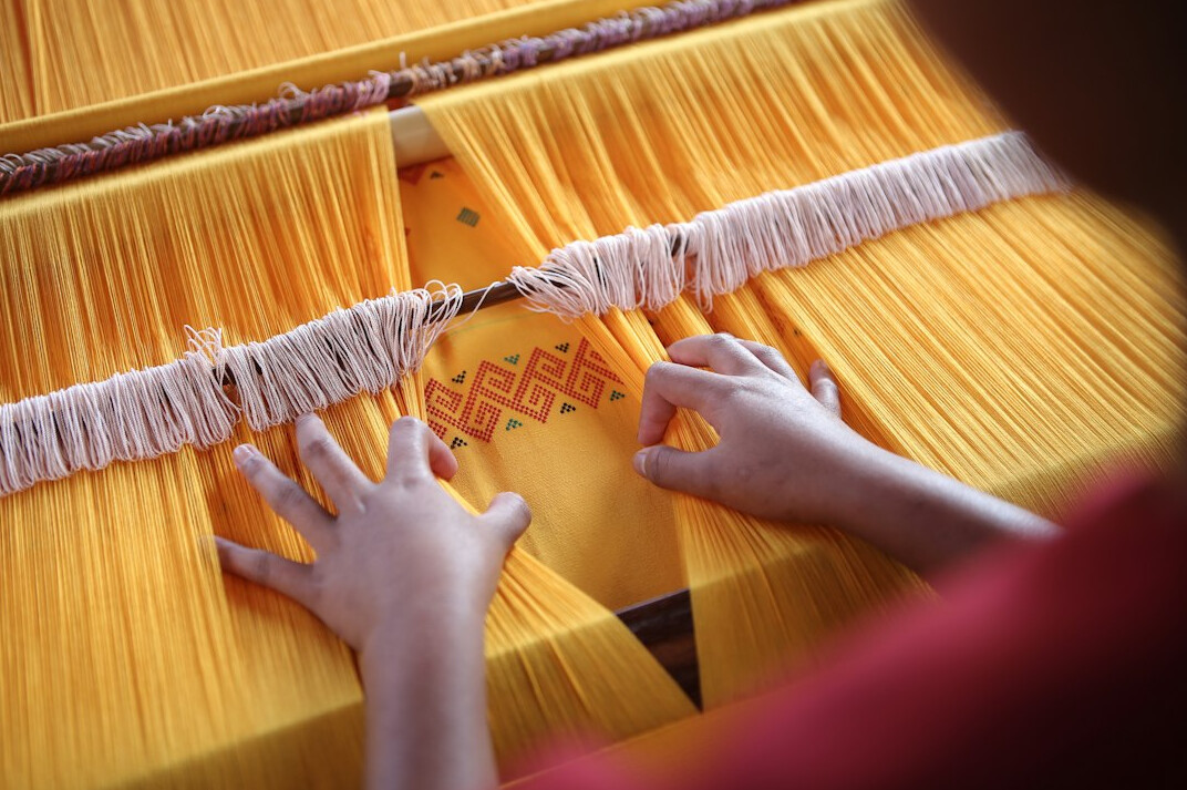 women weaving traditional