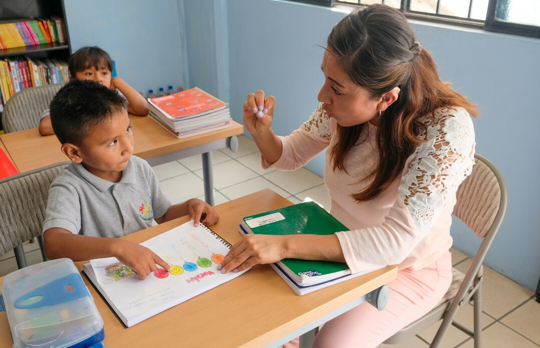 teacher helping students